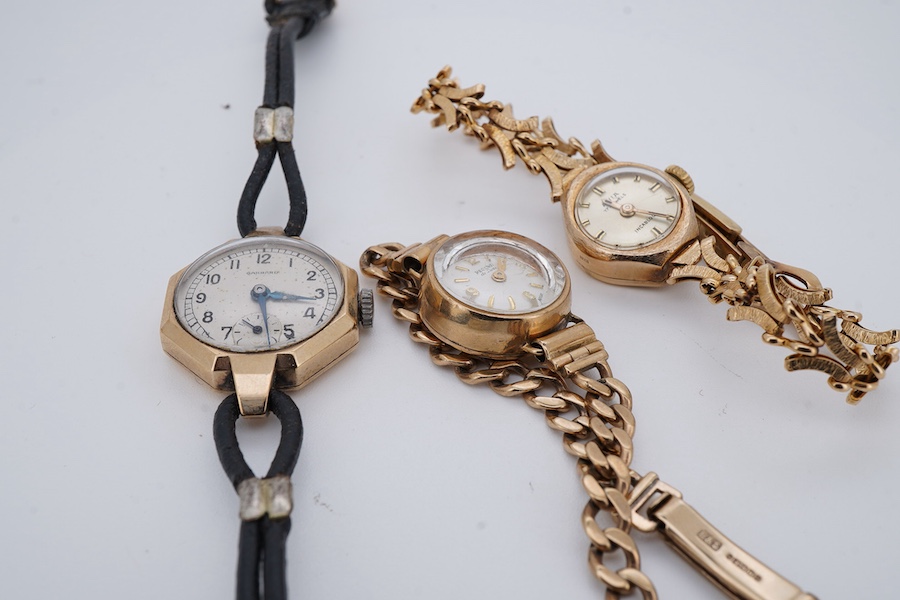 Three lady's 9ct gold wristwatches, mid 20th century, comprising: a gold wristwatch by Record, with a curb link strap; another wristwatch by Avia with a fancy link strap, combined gross weight approximately 23.5 grams; a